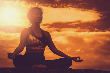 Beautiful women maintain health with yoga exercises.