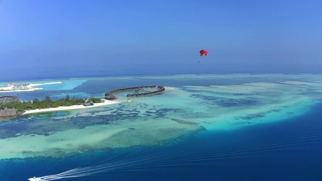 Aerial Shot of South Mal&eacute; Atoll with paraglider