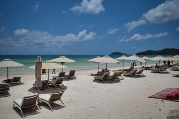 Phu Quoc island, Vietnam: Sunbeds and parasols on beautiful Sao beach with white sand and palm trees
