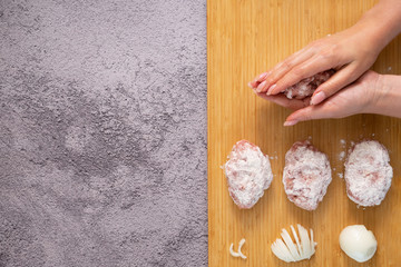 Raw meat patties for frying. The process of cooking meatballs.