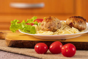 Ready meat patties with salad in a plate on the table. Dish homemade.