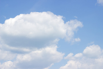 Naklejka na ściany i meble beautiful blue summer sky with fluffy white clouds