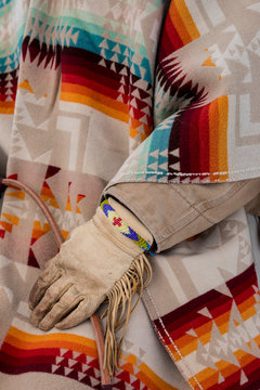 Midsection of cowboy in traditional clothing