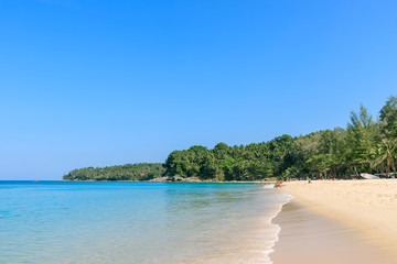 Crystal clear turquoise blue Andaman sea at Surin Beach, Phuket, Thailand