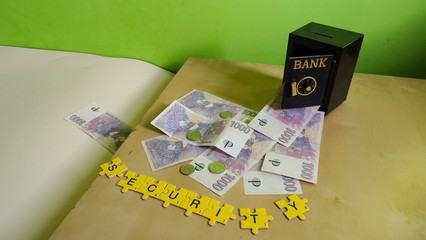 open door of safe vault in bank with money of client flying away, financial concept of banking fraud or swindle posing question about trust of financial institutions (banknotes from Czech Republic)