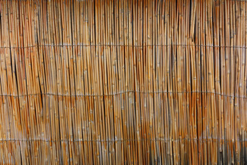 background of reed. tied up. fence from reed. reed texture