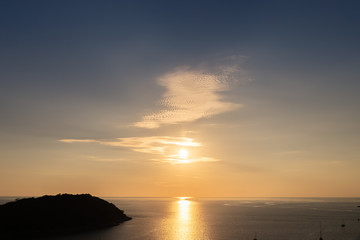 Beautiful sunset on Andaman sea at Windmill View Point near Laem Promthep Cape, Phuket, Thailand