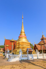 Golden pagoda and Buddha pavilion at Wat Pong Sanuk temple and museum in Lampang, North of Thailand