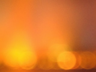 Color gradient of yellow shades with glowing spots of orange and red, like a fiery glow.