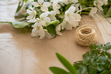 Creating a Botanical bouquet of decorative field herbs on the table