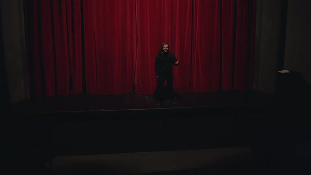 Actor in a theatre reviewing the script