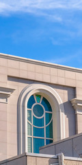 Clear Vertical Building exterior with vibrant blue sky background on a sunny day