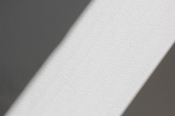 Wall background with sun light and shades, empty black and white canvas 