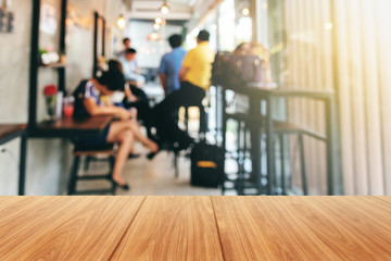 Wooden and Blurred soft images of Group businessmen meeting, planning work together Inside the coffee shop.