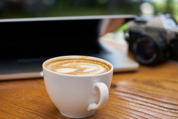 Delicious soft latte coffee on the table