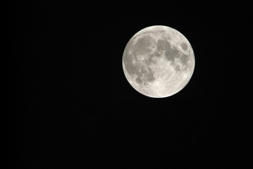 View, of a phase, of the lunar eclipse through a telephoto lens in Turin, Italy