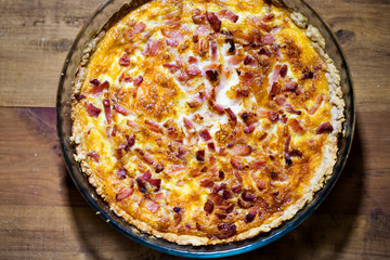 Quiche lorraine on brown table 
