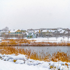 Clear Square Panorama of a lake in Daybreak Utah with wooden decks and snowy shore in winter