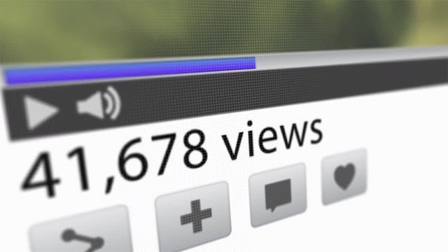 Online web video: multiple views and likes, with numbers going up and up for popular viral internet movie. Ascending number of clicks for thumbs up. Shared by many viewers on social media.