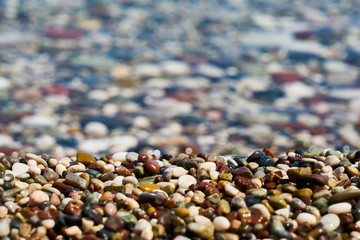 Blue sea and pebbles background