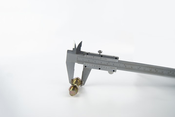 vernier caliper metal measuring nut and bolt on plain isolated white background