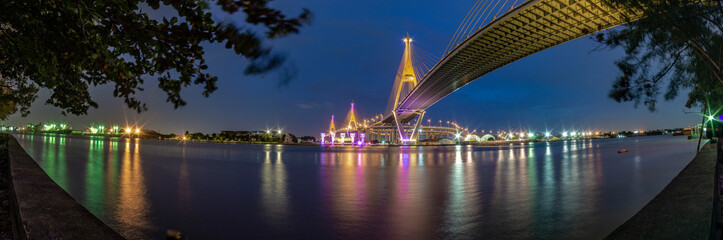 Fototapeta na wymiar Pnorama Bhumibol Bridge, Chao Phraya River Bridge. Turn on the lights in many colors at night.