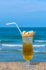 Drinking longan juice on the beach, Concept Holiday and Summer