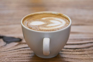 Delicious soft latte coffee on the table
