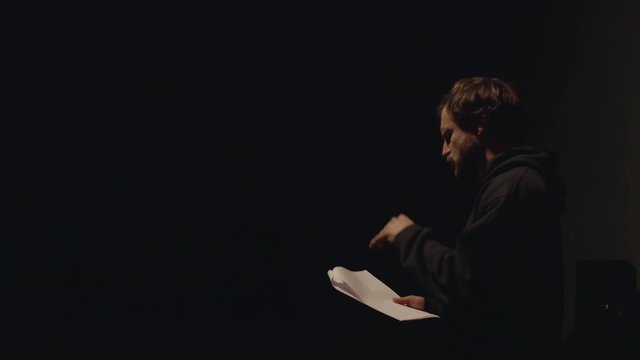 Actor in a theatre reviewing the script