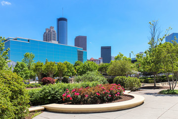 Beautiful view from downtown park with foreground flowers and trees on Atlanta skyline