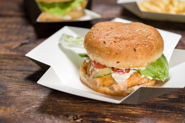 White wheat burger. Burger close up. Burger sprinkled with seeds.