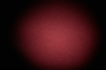 Volumetric textural cloud of burgundy light on a black background