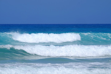 Naklejka na ściany i meble Wave of in blue ocean.