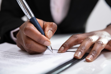 Woman Signing A Contract
