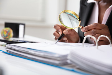 Businessperson Examining Bill