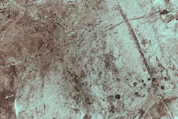 Vintage cyan background. Rough painted wall of hazel color. Imperfect plane of brown colored. Uneven old decorative toned backdrop of blue tint. Texture of azure hue. Ornamental stony surface.