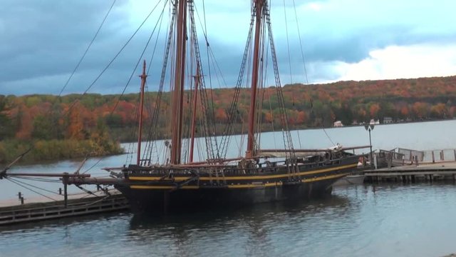 Sailing, two-masted brig parked at the pier