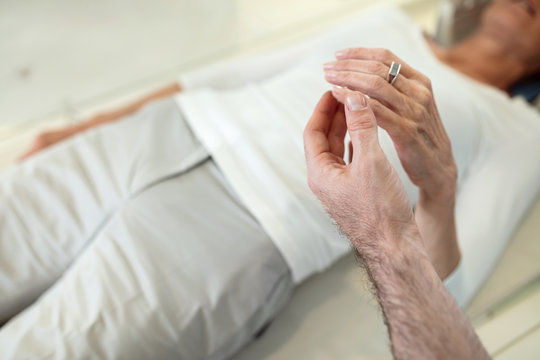 Supporting patient during medical examination.