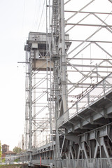 Fototapeta na wymiar metal gray structures of the railway bridge