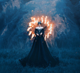 Fantasy gothic woman dark queen of night, majestic priestess in long black dress with bare...