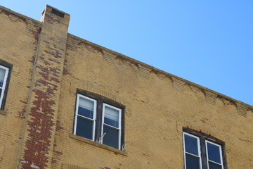 Vacant brick apartment building in urban neighborhood 