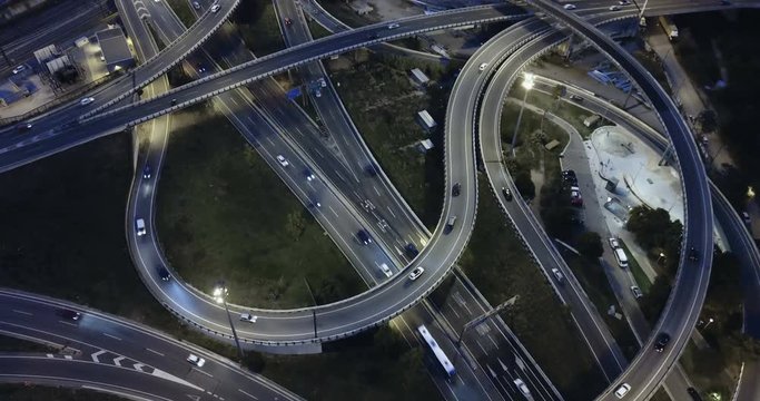 Aerial view of lighted highway road junctions at night