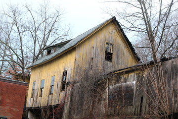 Old abandoned and decayed wooden historic  barn 