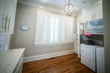 Spacious Laundry Room in a Large Home with Vaulted Ceilings