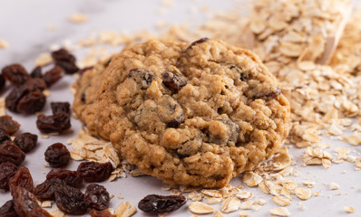 Cinnamon Raisin Oatmeal Cookies with Ingredients on a Marble Counter