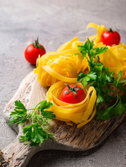 Raw pasta tagliatelle or fettuccine