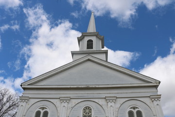 Fototapeta na wymiar White wooden church steeple in historic New England town