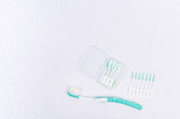 Toothbrush on a white background and chopsticks. Flat lay.