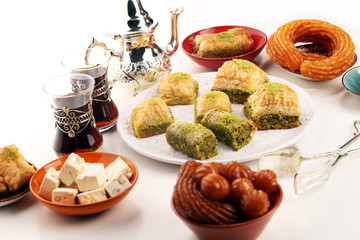 Middle eastern or arabic dishes. Turkish Dessert Baklava with pistachio on dishes