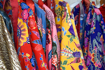 Colourful red, blue and yellow kimono's in Naha Okinawa Japan